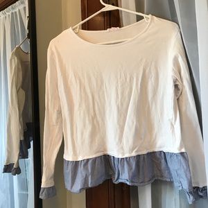 Long sleeve top with ruffles on sleeve and bottom!